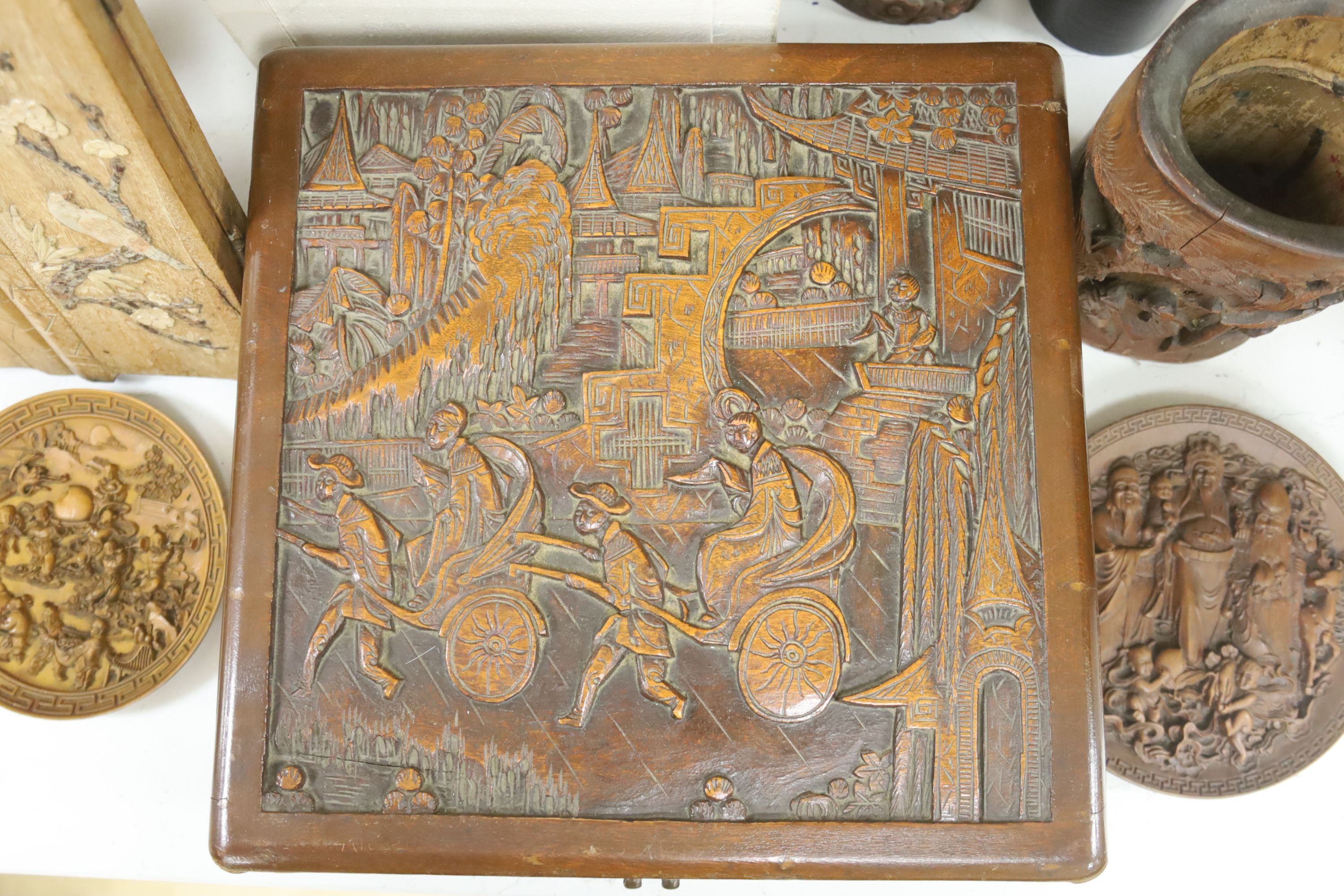 A quantity of 20th century Chinese carved bamboo and wooden effects to include a large brush pot, 17cm high (7)